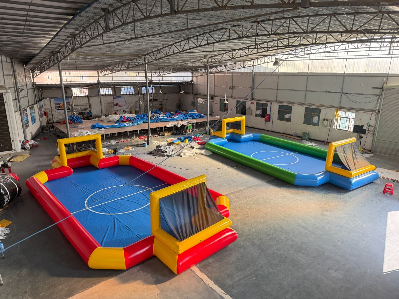 Inflatable human foosball pitches for events and recreation centres.