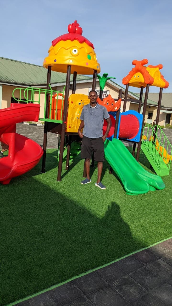A colourful multiplay structure with slides installed and ready for children at a recreation centre by Ere Ayo Mothercare Toys.