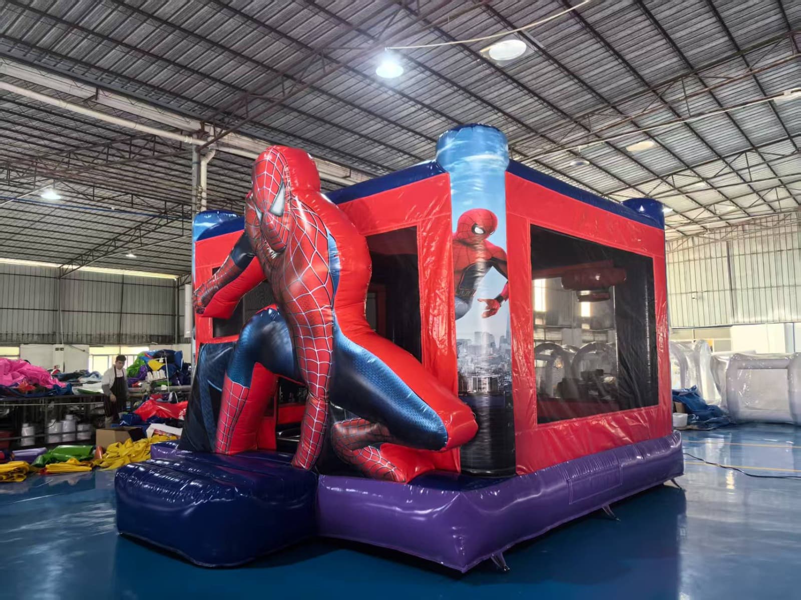 Superhero themed inflatable bounce house.