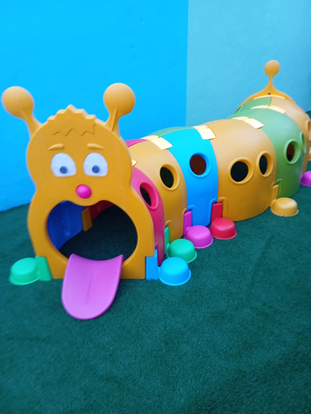 Modular caterpillar crawl tunnel for indoor soft play.